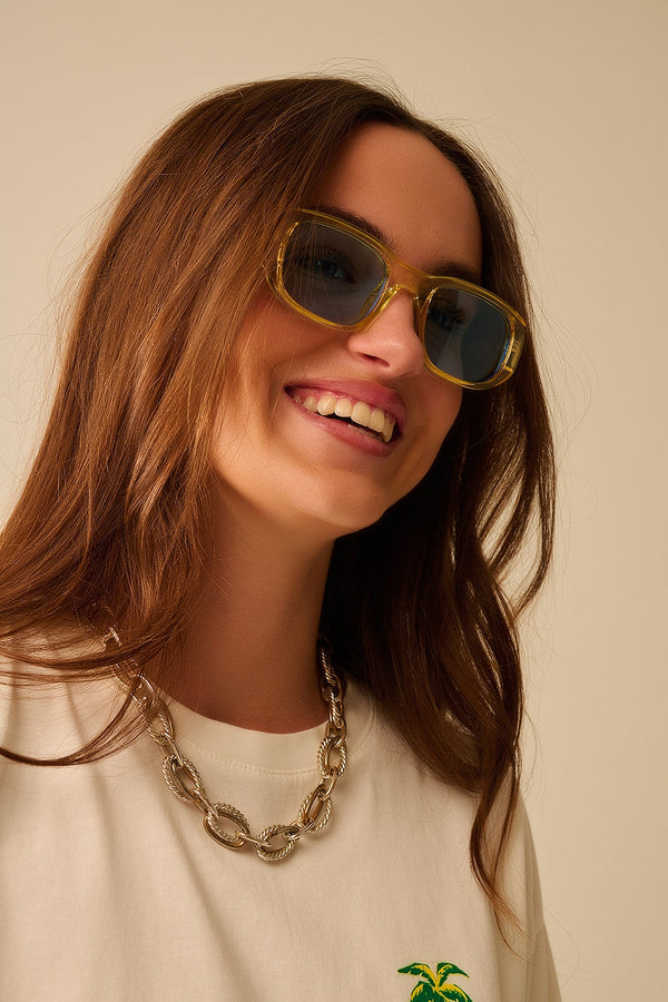 Oval Sunglasses With High Gloss Transparent Frames in Yellow